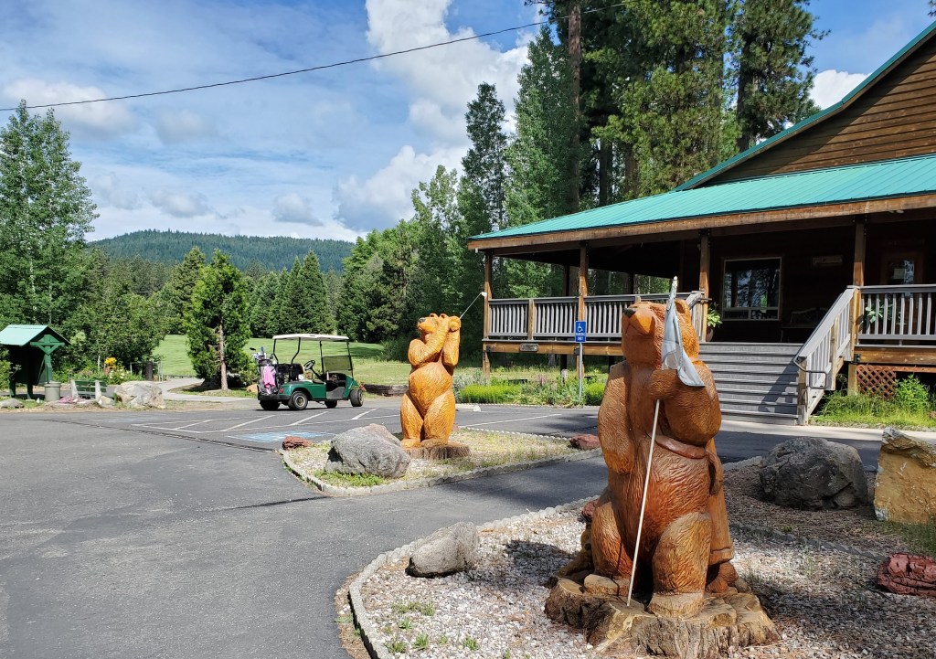 Bear mascots in front of clubhouse
